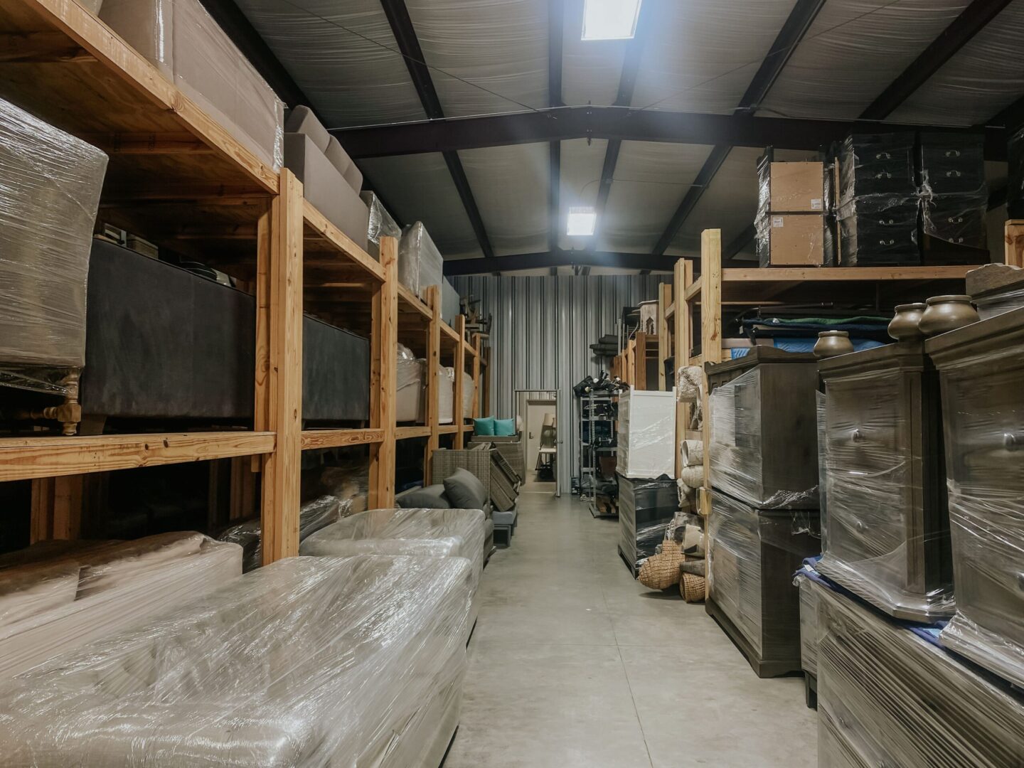 A warehouse full of furniture and boxes.